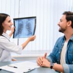 Lung,Disease.,Young,Female,Doctor,Showing,Chest,X-ray,To,Her