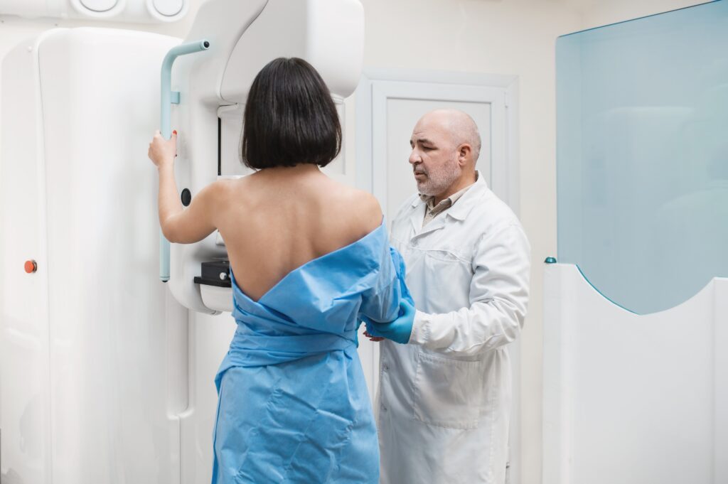 Man,Doctor,Stands,Against,The,Background,Of,Patient,Who,Is